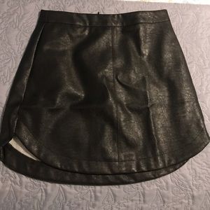 Black faux leather rounded hem skirt. NWT